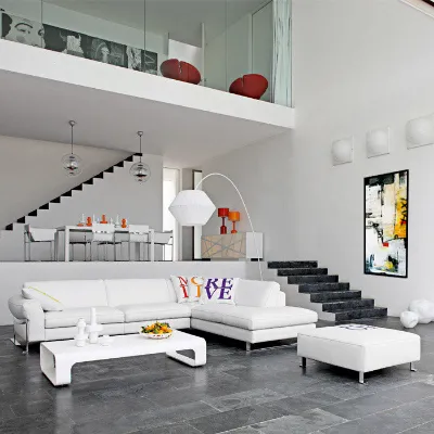 A tall abstract painting in a white double-height living room